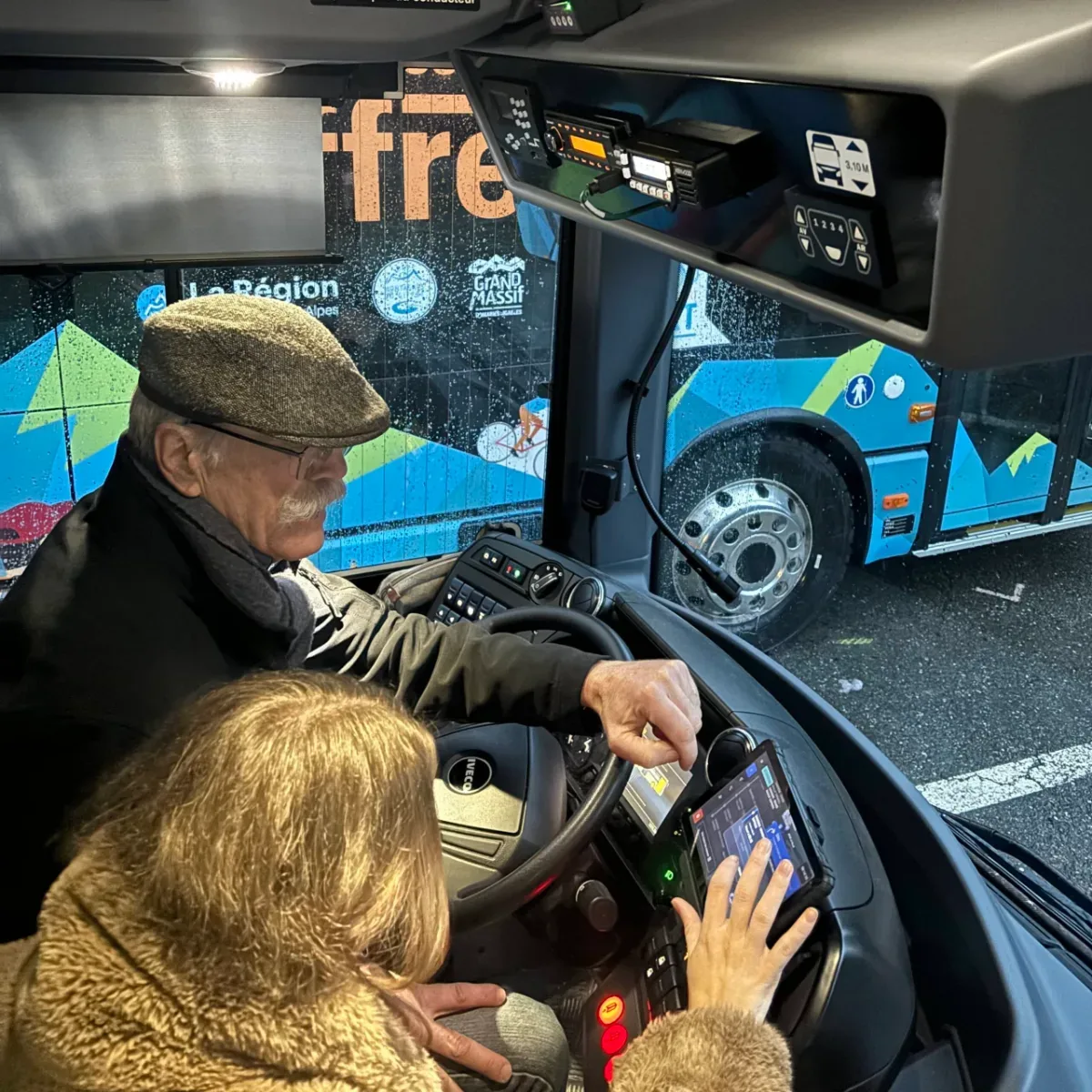 A driver being coached on the Geolite tablet